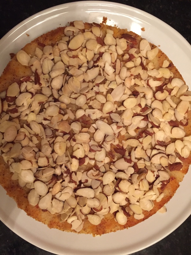 Peach cake with almonds on top